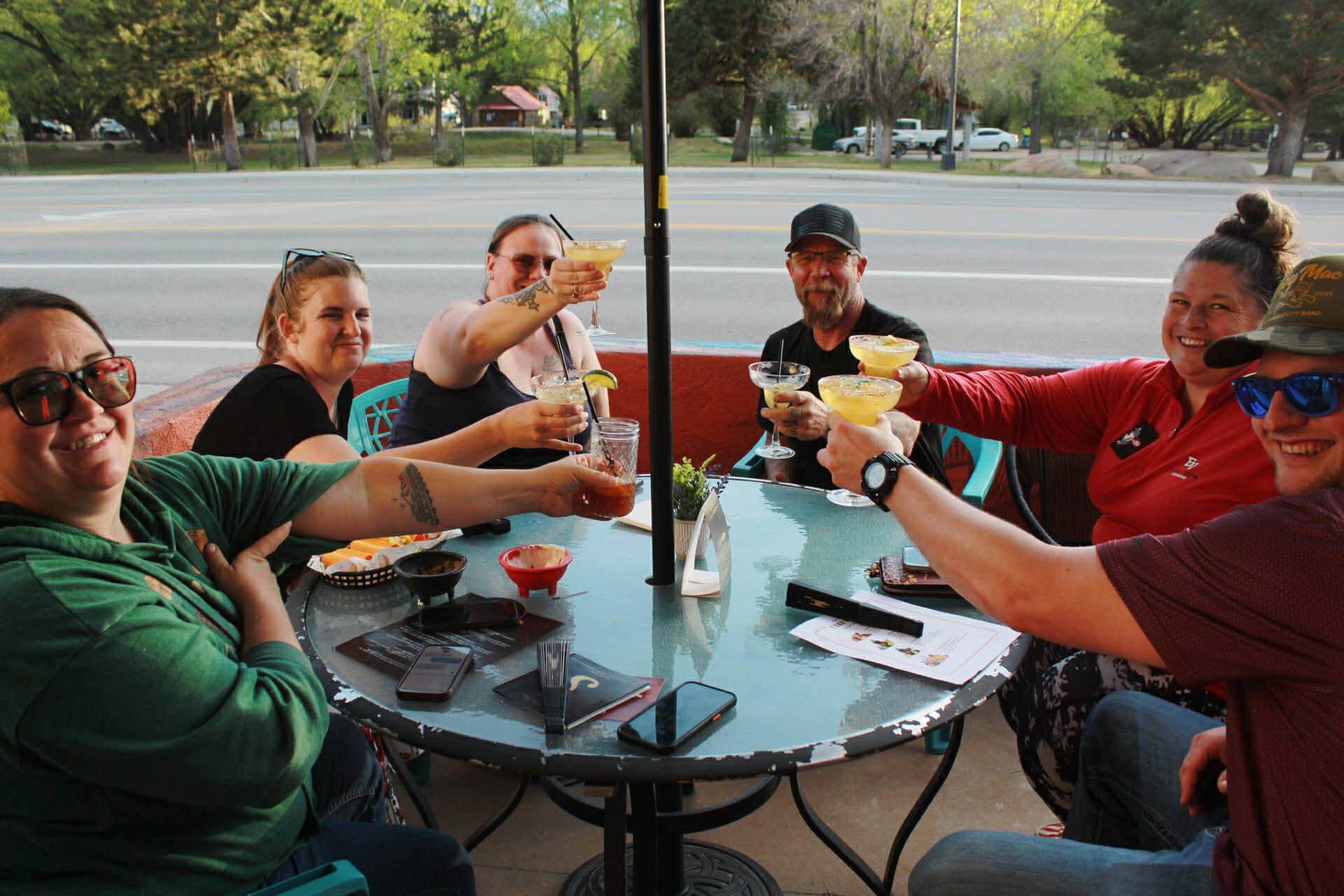 Guests cheering with margaritas at Mountain Oasis